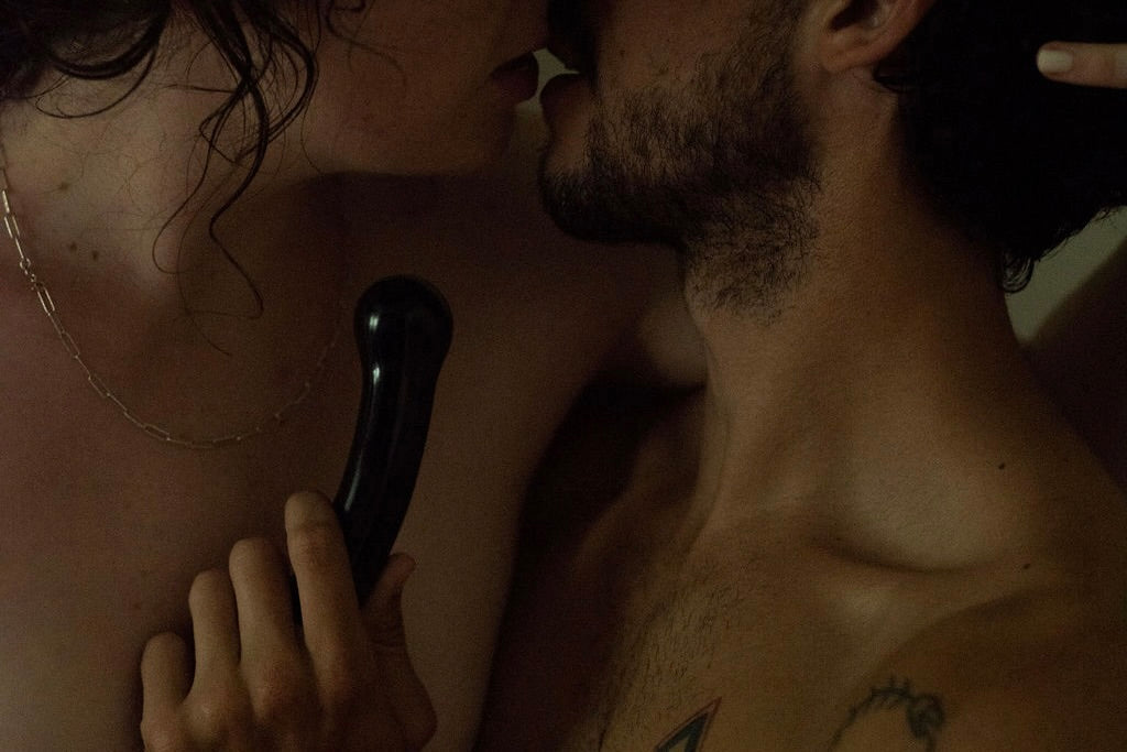 Couple using sex toys together 