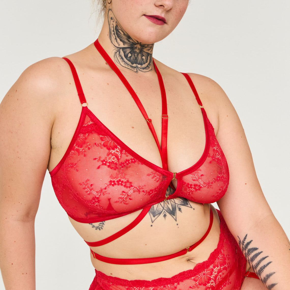 Woman wearing a red lace lingerie set 