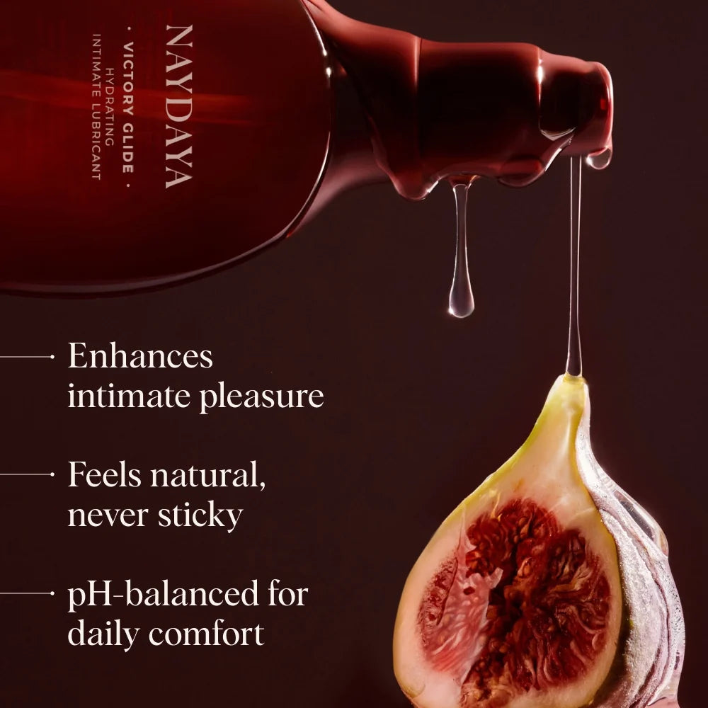 Nayda Victoria Glide Intimate Lubricant bottle shown with a dripping dark red liquid above a halved fig on a dark brown background, with  benefits.