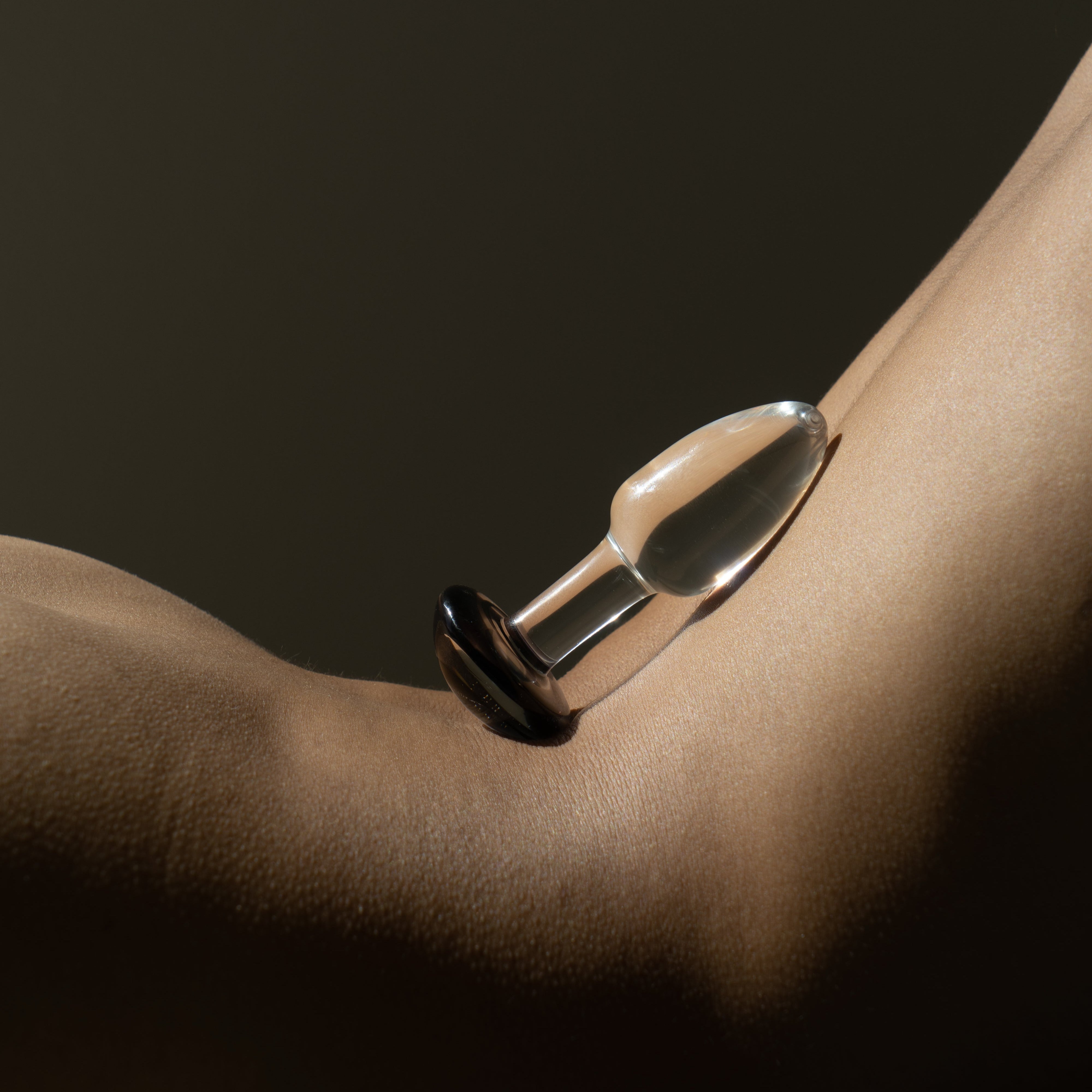 Glass plug with black stopper